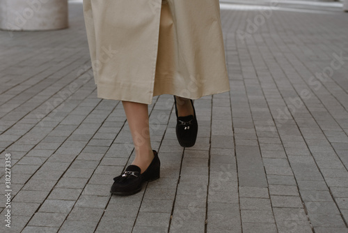 Close up shot of woman's legs walking photo