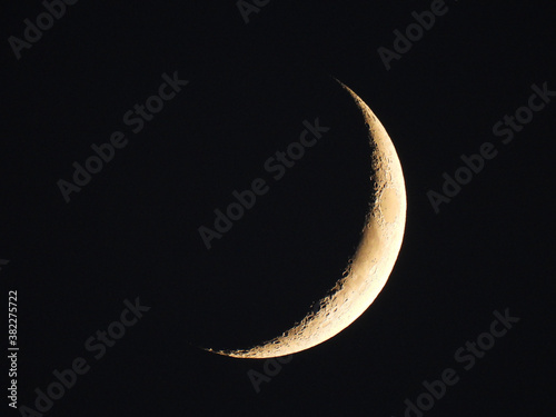 Bright Quarter Crescent Moon in Black Dark Sky 