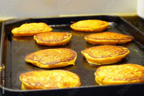 Canvas Print Cooking vegan pumpkin pancakes on a griddle