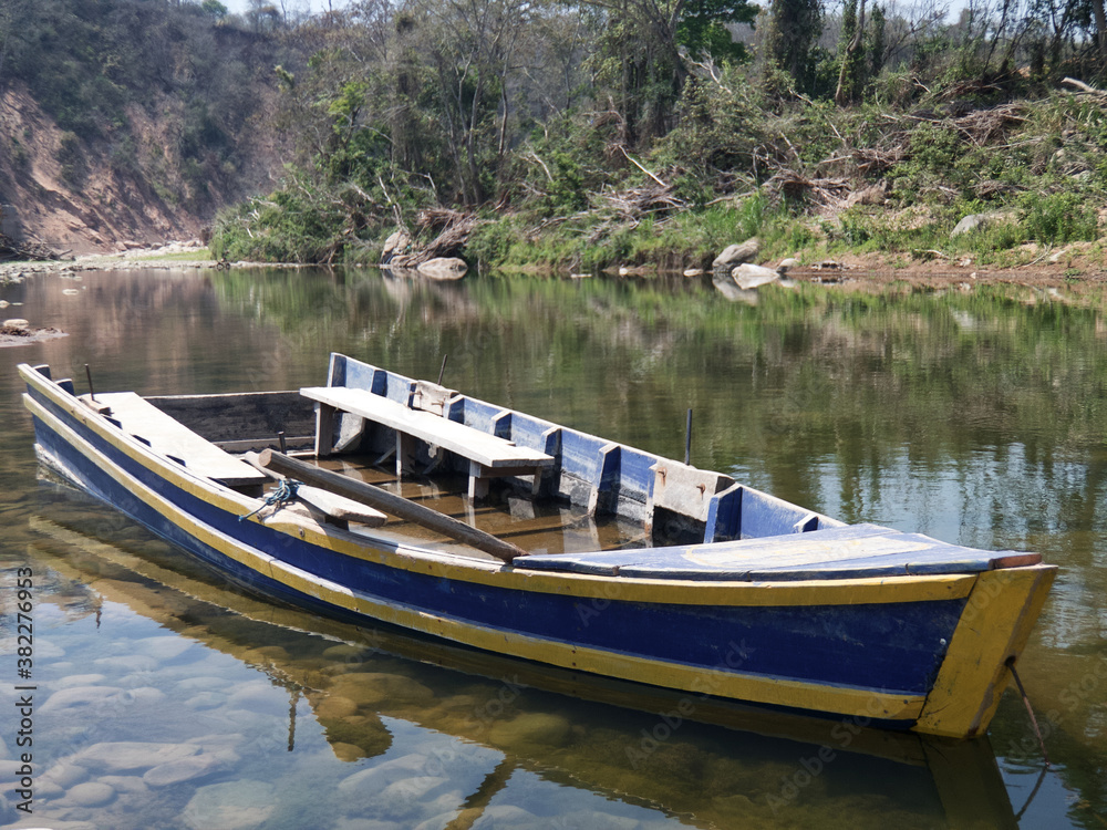 Old wooden fishing boat on the river.Peaceful Landscape.