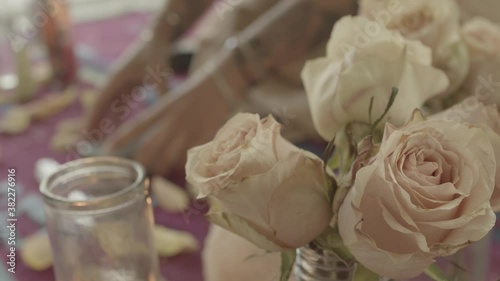 Witch Laying Tarot Cards with roses and incense  photo