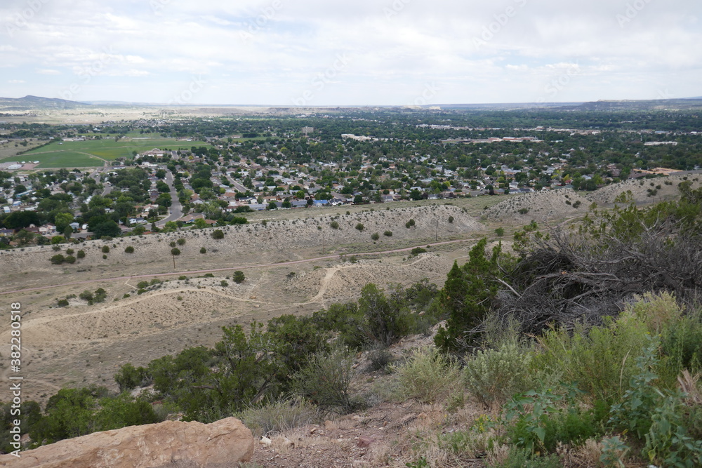High view from mountaintop over distant city below High view from mountaintop over distant city below