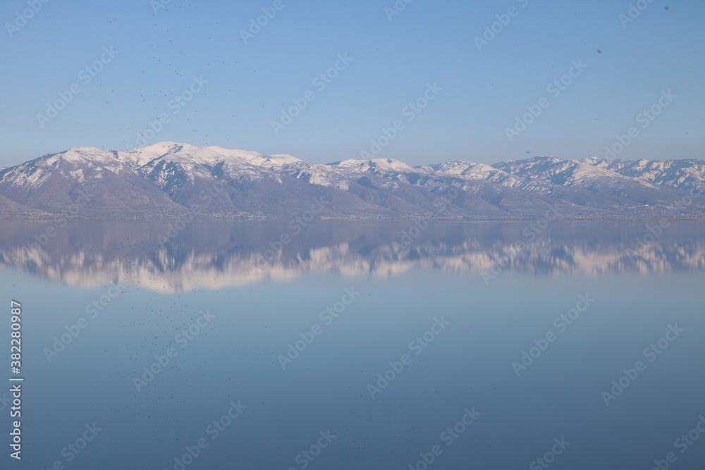 Fototapeta premium Reflections of Wasatch Mountains in the Great Salt Lake, Antelope Island State Park, Utah