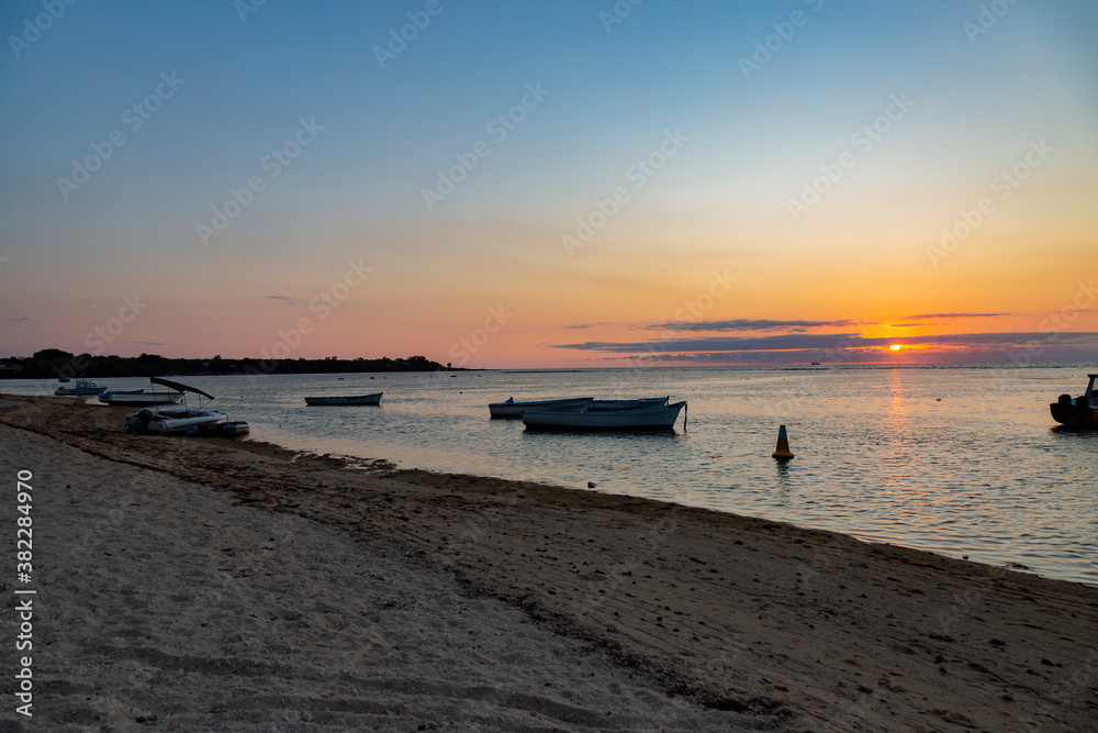 sunset on the beach of Albion, Mauritius. 