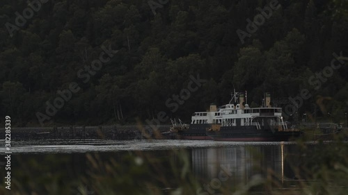 A boat laying still in Tinnsjo,  a lake in Rjukan Norway photo