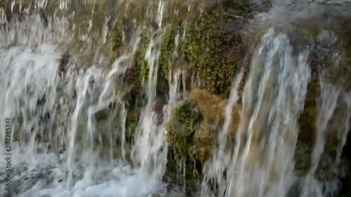 View of water flowing from a concrete creek photo