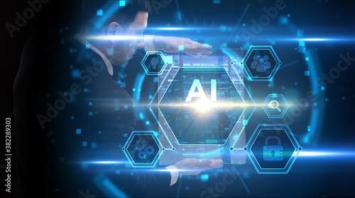 Business, Technology, Internet and network concept. Young businessman working on a virtual screen of the future and sees the inscription: AI