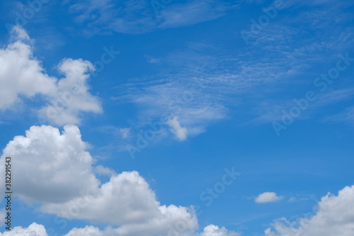 Blue sky with white clouds in daylight for background.