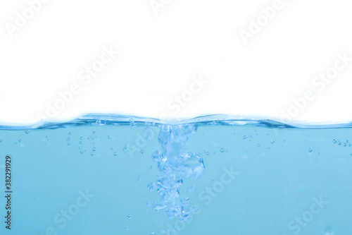 Water waves and light blue water droplets crystal clear on white background