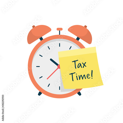 Tax Time. Alarm Clock with Tax Time Sticky Note.