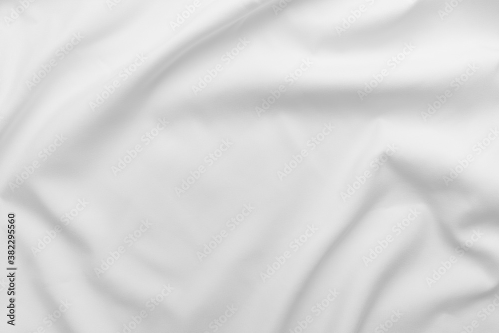 Abstract white fabric texture background. Cloth soft wave. Creases of satin, silk, and cotton. Abstract white fabric texture background. Cloth soft wave. Creases of satin, silk, and cotton.