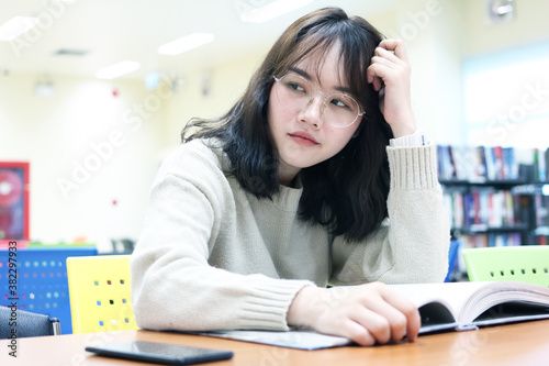 education,woman,office, campus, friendship and people concept of happy teenage students with school folders School books on desk, education concept Young students campus helps friend catching.