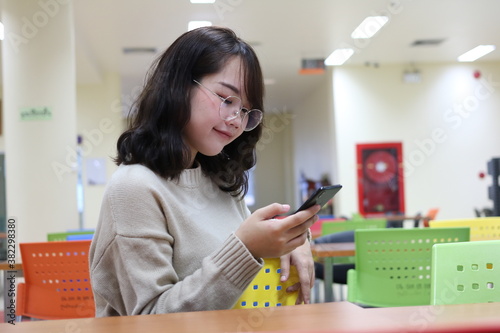 technology and education,woman,office, Young asian woman use your a smartphone to browse the internet Social media