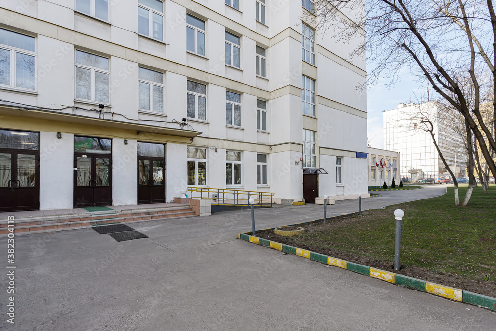 School building with an empty courtyard. School building with an empty courtyard.