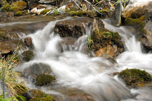 Mountain stream in the Altai Republic. Water runs over rocks  close up