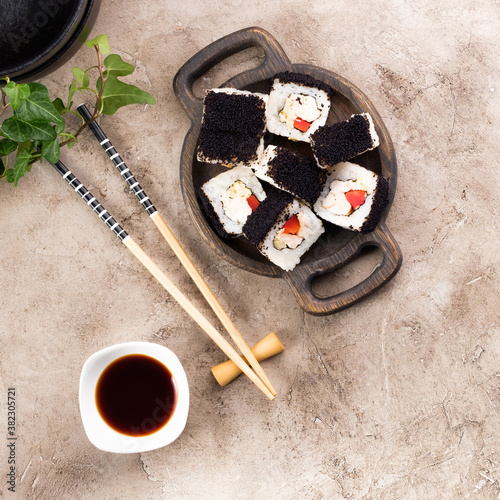 Japanese sushi food. Top view of sushi. Rolls with masaga caviar. Unusual composition of rolls. photo