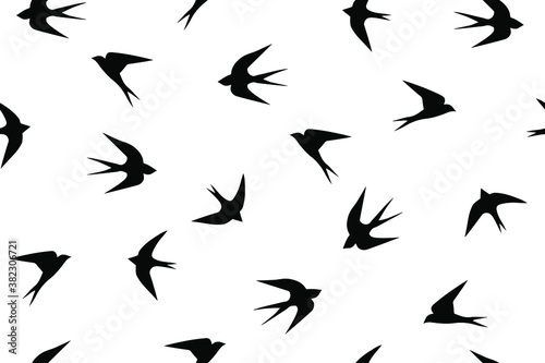 Swallows. Black birds on a white background. Seamless Vector Illustration