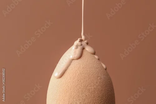 Obraz Sponge with foundation for makeup on color background