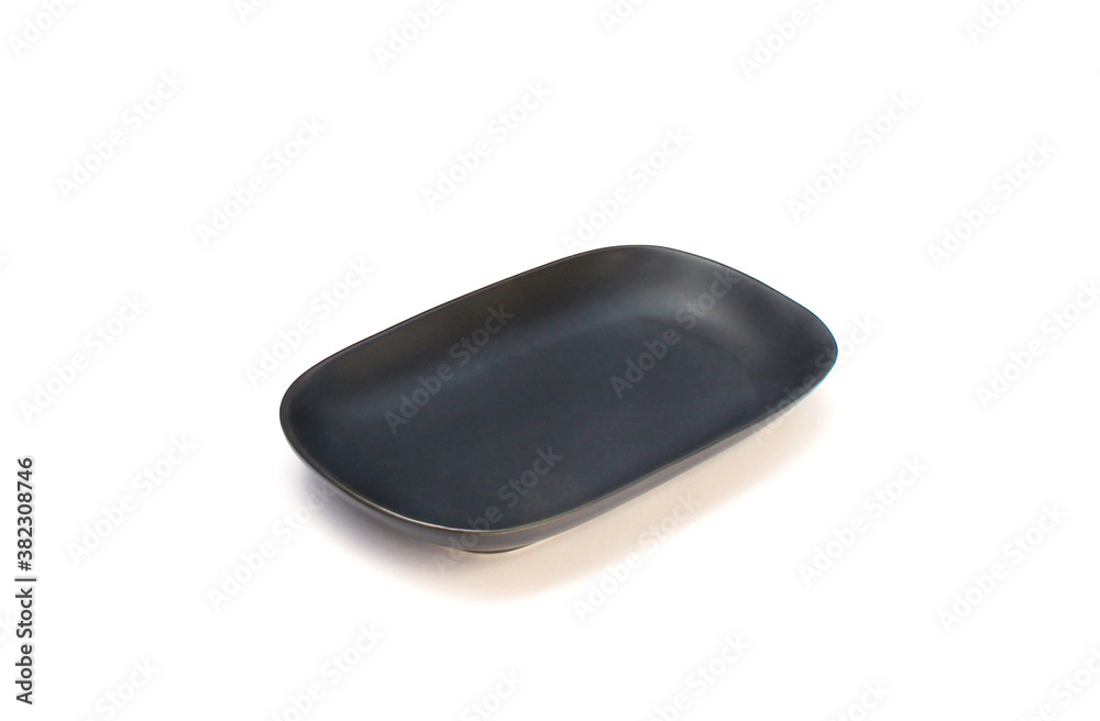 Empty ceramics black plate isolated on white background with clipping path Empty ceramics black plate isolated on white background with clipping path
