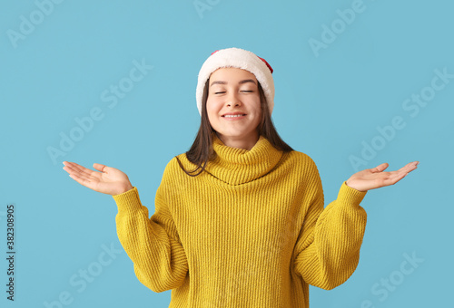 Happy young woman in Santa ...
