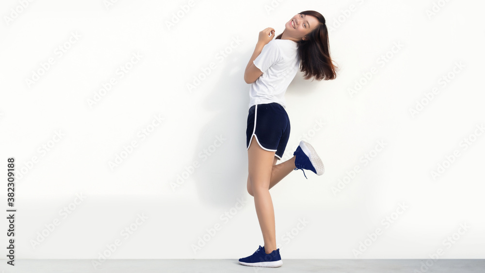 Obraz premium happy running woman on white background.
