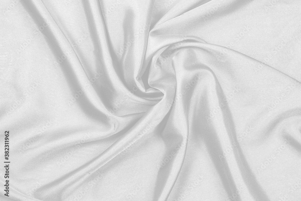 Obraz premium Smooth elegant white silk fabric or satin luxury cloth texture can use as wedding background. for drapery luxurious abstract design