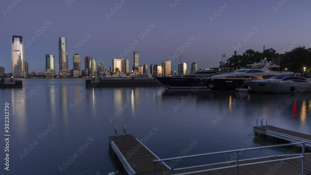Jersey City skyline from Hudson river yacht club in the night to day time lapse Jersey City skyline from Hudson river yacht club in the night to day time lapse