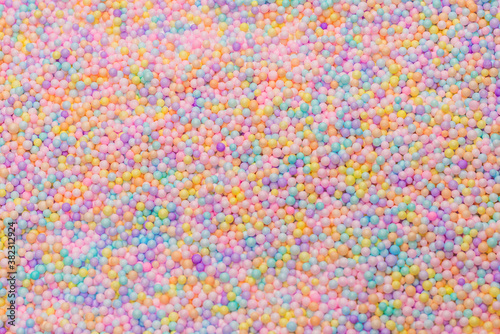 Purple, yellow, blue plastic balls.