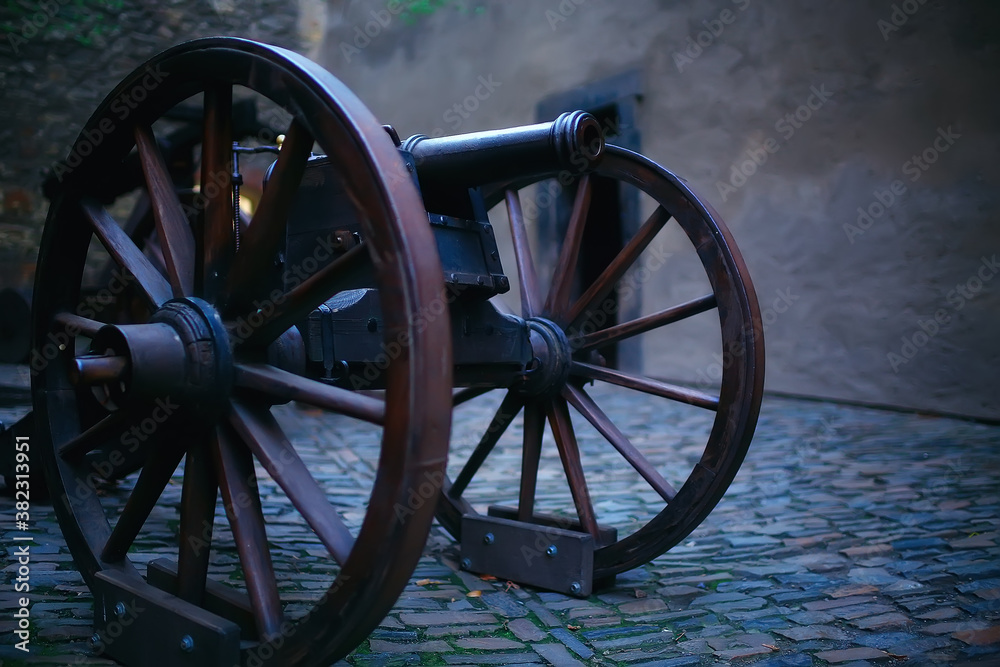 An ancient cannon / exhibition of an antique historical cannon in an old castle, a vintage weapon