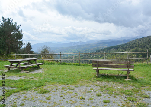 FRANCE WITH THE BORDER OF SPAIN, EUROPE, SEPTEMBER 2020. Picnic area and wooden bnco with fantastic views at the top of the border of the Pyrenees that separates France from Catalonia, Spain.