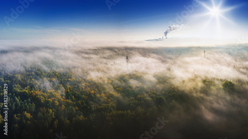 nature and industry - landscape from above in the early morning in the fog