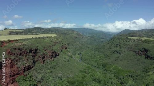 South Kauai Hanapepe Valley Lookout drone view. Aerial lifting panorama rising shot of canyon on picture perfect sunny day photo