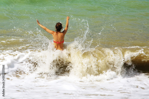 Young woman having fun in stormy sea © Svetlana Lukienko