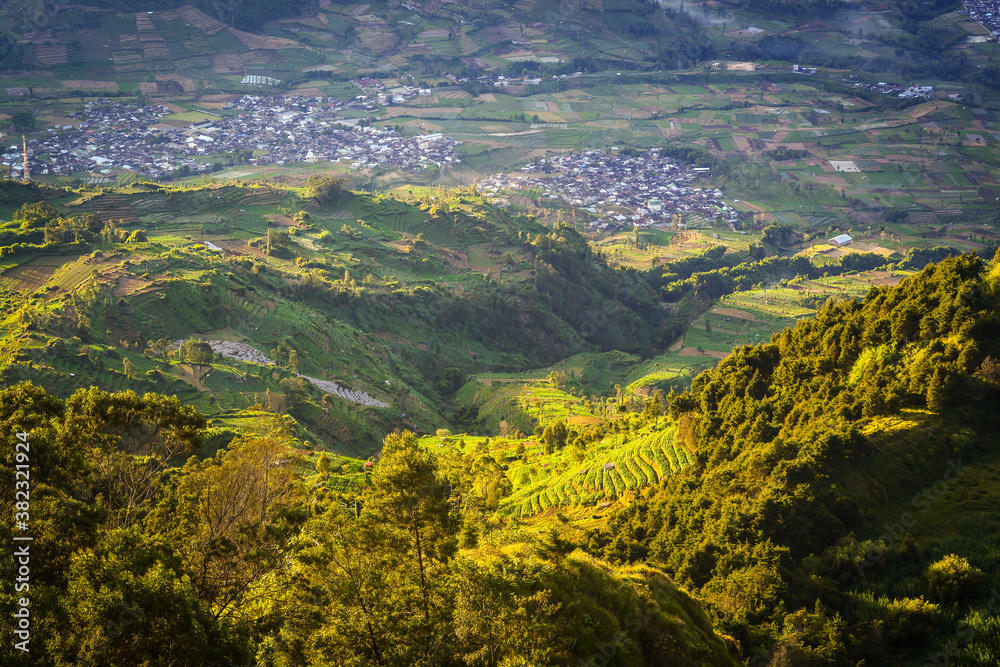 Aerial view countryside of Dieng village. Mountain scenery from above. 