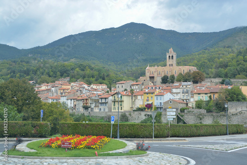 Obraz na płótnie PRATS DE MOLLO LA PRESTE, FRANCE, EUROPE, SEPTEMBER 2020. Entrance on the road to Prats de Mollo. In front of it you can see a roundabout with a Catalan flag (estelada) w salonie
