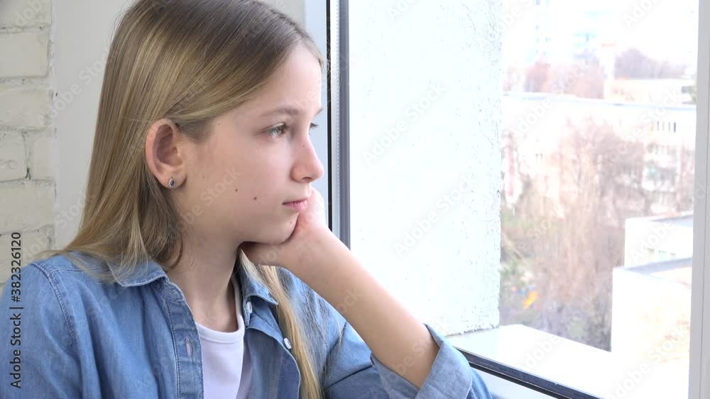 Sad Kid Looking on Window, Unhappy Child, Bored Thoughtful Girl, Teenager Face, Isolated People at Home in Coronavirus Crises Sad Kid Looking on Window, Unhappy Child, Bored Thoughtful Girl, Teenager Face, Isolated People at Home in Coronavirus Crises