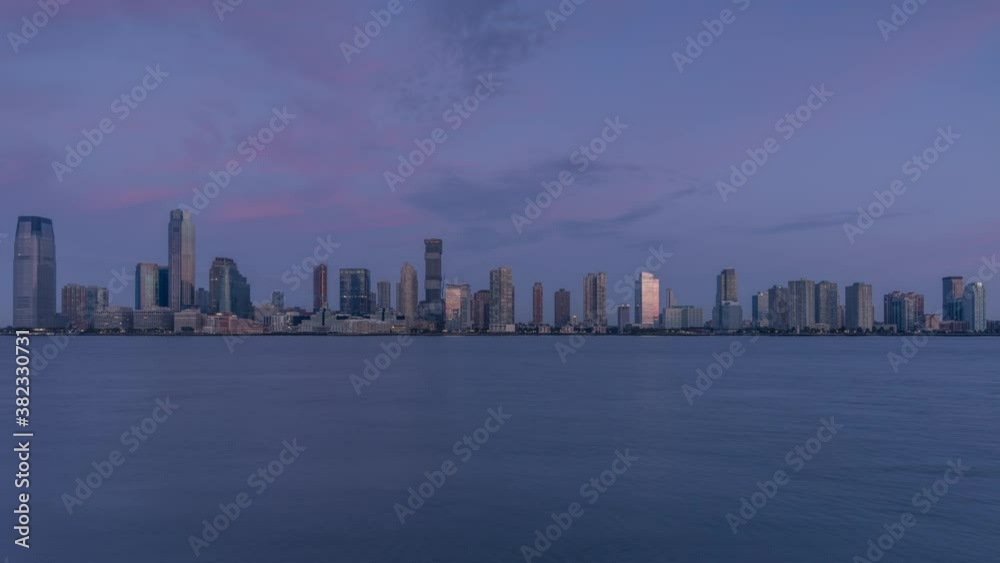 Jersey City skyline during sunrise in time lapse Jersey City skyline during sunrise in time lapse