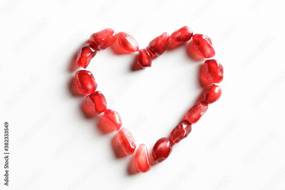 Pomegranate heart isolated on white background Pomegranate heart isolated on white background