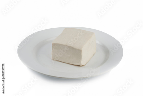 close-up white tofu on a white plate isolated