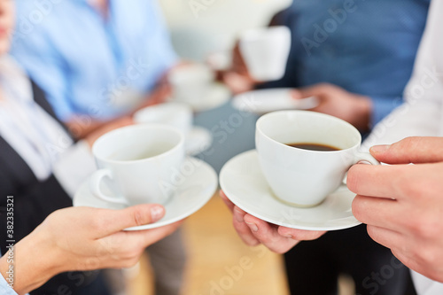 Business people having a break while drinking coffee