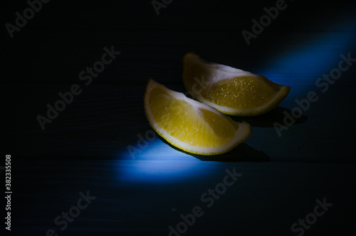 Still life with lime and lemons on the wooden background