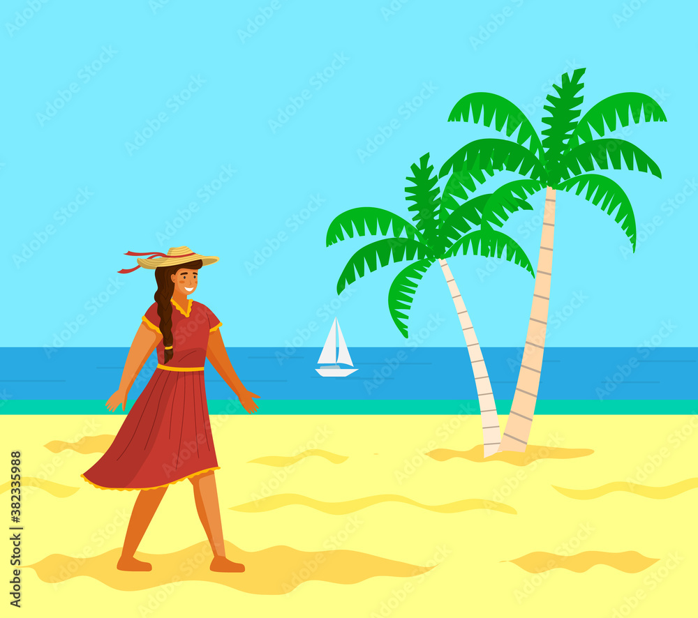 Young long-haired girl in red dress, wide-brimmed hat, beige shoes walking on beach. Tanned young woman under sun. Girl in bright summer dress, with tanned skin. Palms, ocean, sailboat, sun, wind