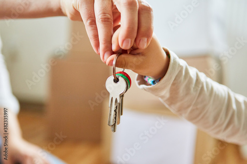 Father and son hold home keys