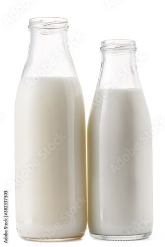 Open glass bottle of milk isolated on white