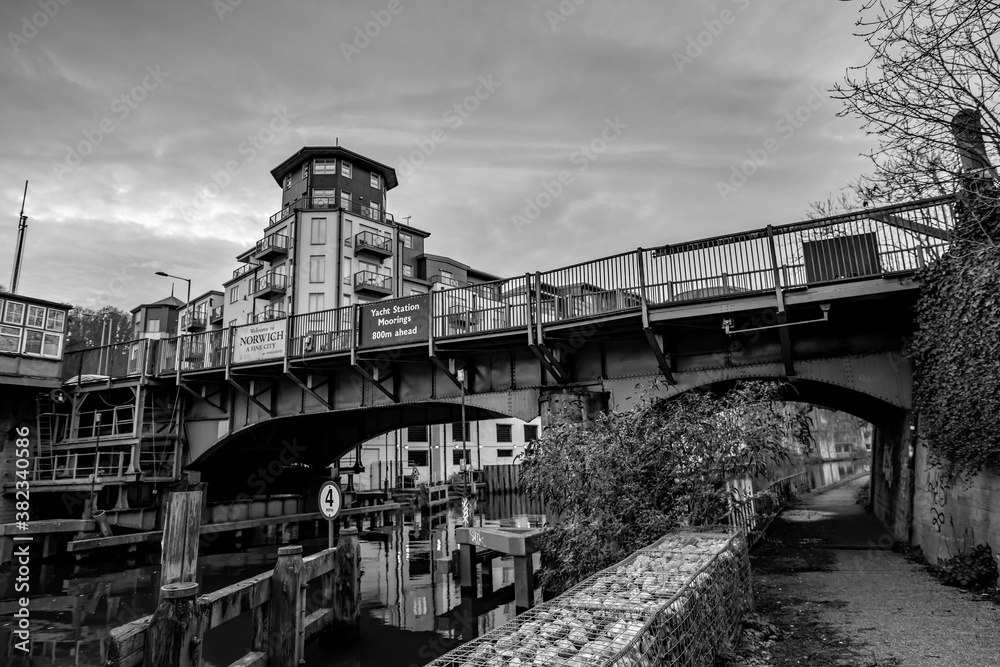 Black and white photo of theCarrow Bridge crossing over the River Wensum in the city of Norwich 
