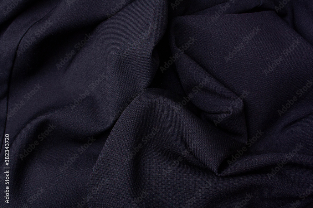 Fototapeta premium Black fabric folds background. View from above. Black friday concept sale