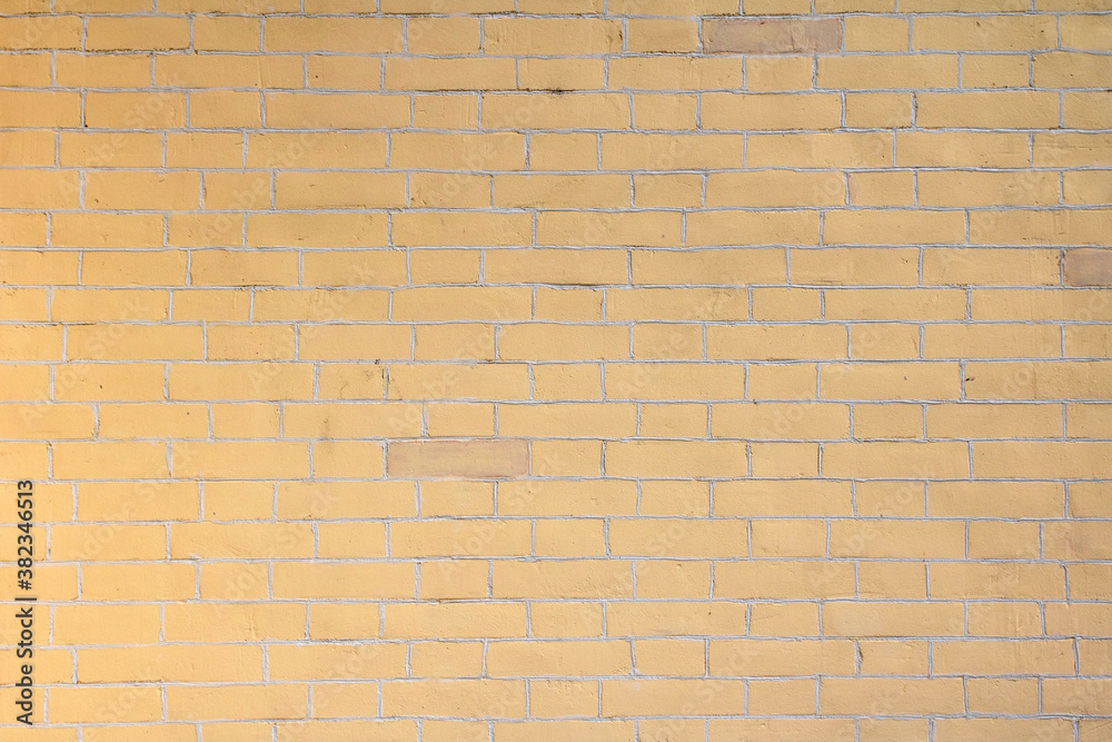 Obraz premium Yellow background wall of decorative bricks.