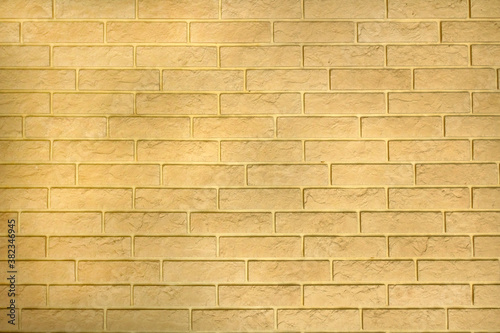 Yellow background wall texture from decorative bricks.