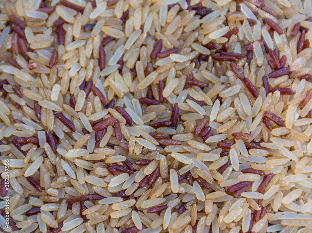 Brown rice close-up on background