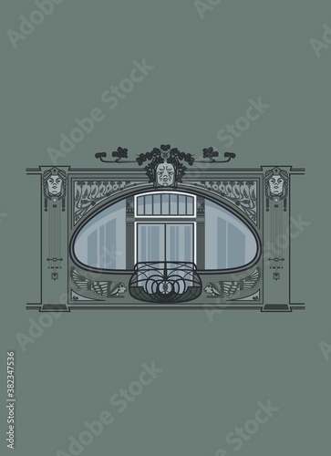 Art Nouveau window with decorative details. Jugendstil window frame. Building facade with a french balcony. 